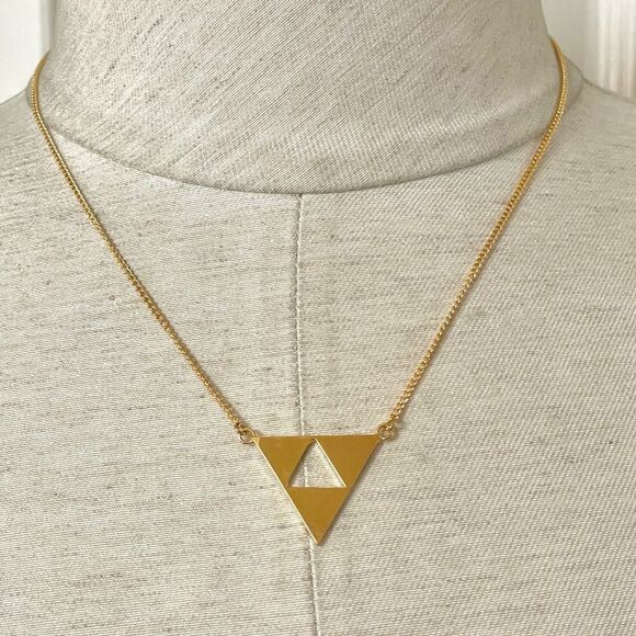 Trina Turk gold tone cut out triangle pendant necklace - Picture 1 of 11